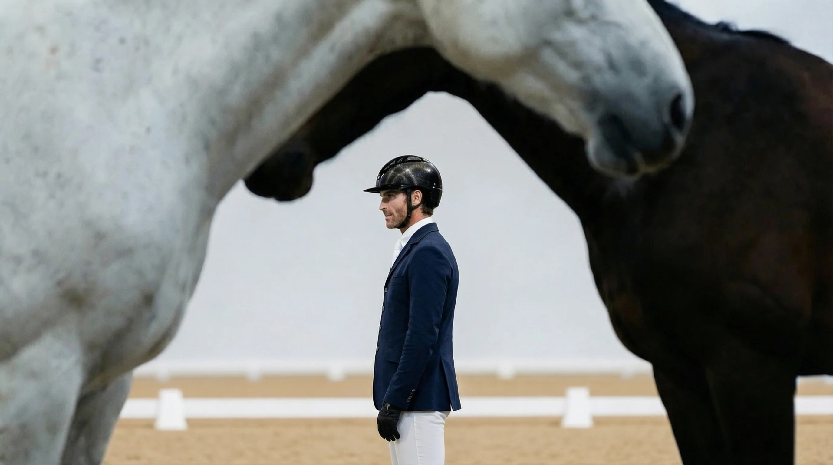 Quentin Judge standing with horses